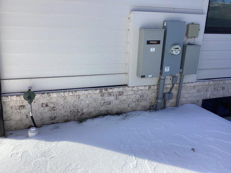 Conducted a comprehensive electrical assessment for generator installation. Inspected existing electrical panel to evaluate available capacity and connection points, and examined exterior wall utilities including the Generac unit and associated electrical panels to determine optimal integration strategy for the generator system.