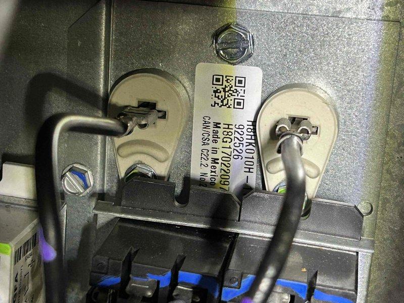 Responded to no heat call for electric heat pump system less than 10 years old. Upon inspection of the air handler in the crawl space, identified faulty thermal limit switch with improper electrical connections. Replaced thermal switch component and verified proper wiring to terminal connections. System tested and confirmed proper heat operation before completing service.