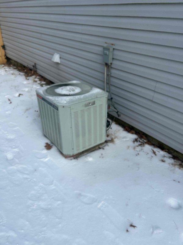 Responded to no-heat service call for 38-year-old electric HVAC system. Upon inspection, discovered significant frost accumulation on outdoor unit and deteriorating ductwork insulation in crawlspace. Performed defrost cycle and replaced aging components to restore heating functionality.