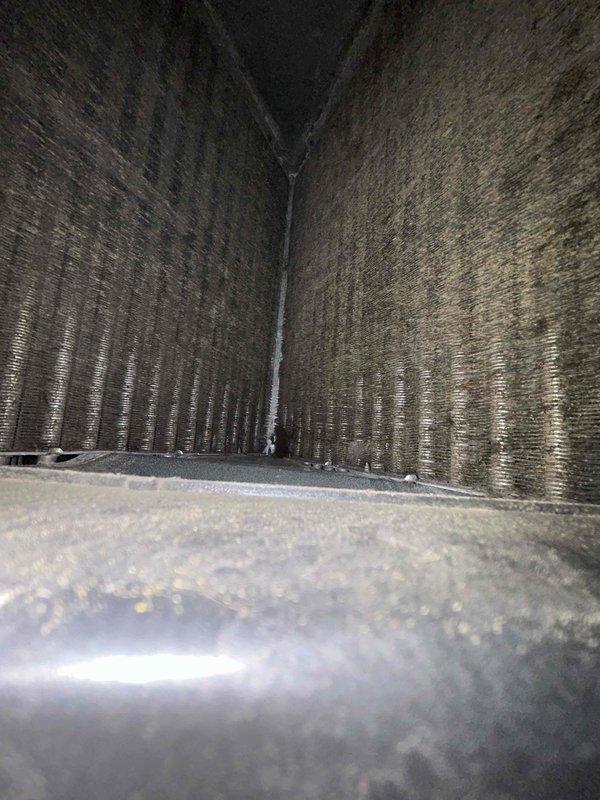 Responded to no heat call for a 20+ year old gas furnace system. Upon inspection, found significant dust and debris accumulation on the evaporator coil and interior ductwork, restricting proper airflow. Cleaned accumulated debris from heat exchanger components and recommended regular maintenance to prevent future heating failures.