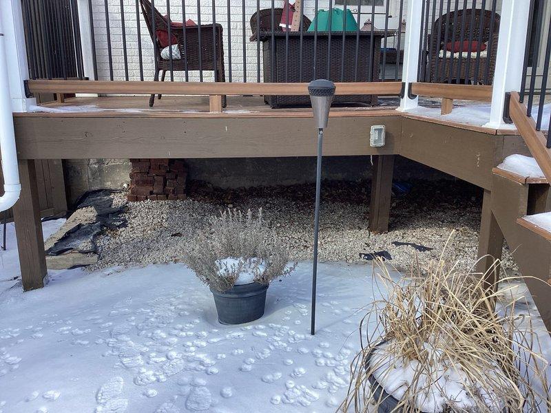 Performed site inspection for generator installation. Assessed existing 200-amp electrical panel with available capacity for generator integration. Evaluated potential outdoor placement location under deck, noting snow conditions and spatial constraints that would affect installation requirements. Documented current electrical infrastructure to determine appropriate transfer switch specifications and wiring needs.