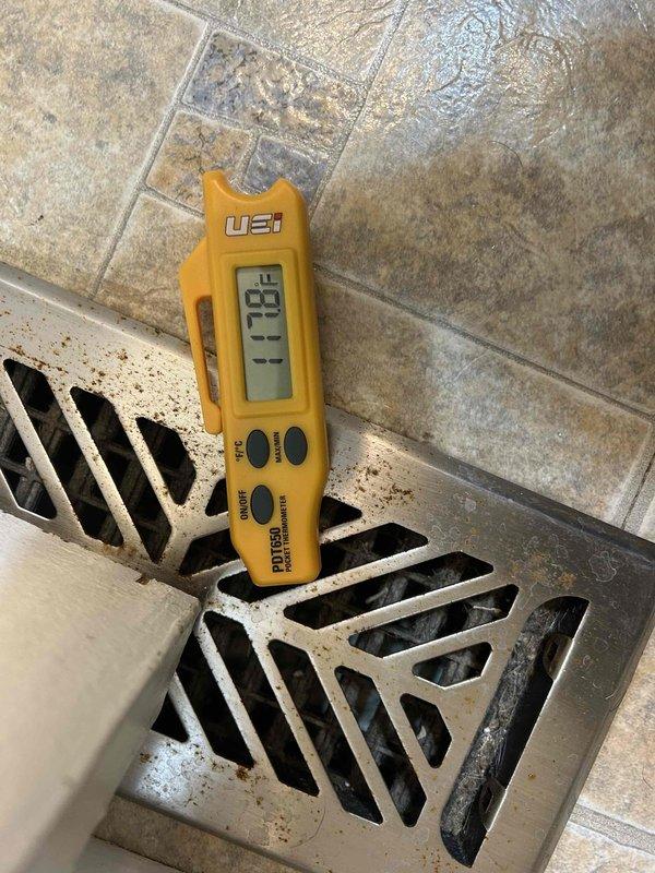 Inspected system installed in December that was not maintaining proper temperature (67° actual with 72° set point). Measured supply air temperature at 79.9°F with UEI PDT650 thermometer. Found heavily clogged air filter restricting airflow. Diagnosed defrost cycle malfunction and insufficient auxiliary heat operation. Replaced filter and recalibrated defrost controls to restore proper system performance.