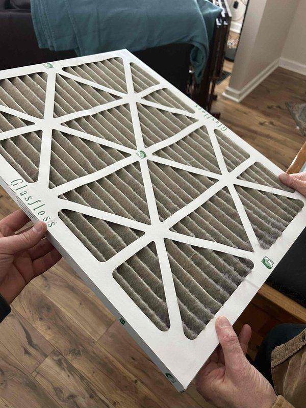 Inspected system installed in December that was not maintaining proper temperature (67° actual with 72° set point). Measured supply air temperature at 79.9°F with UEI PDT650 thermometer. Found heavily clogged air filter restricting airflow. Diagnosed defrost cycle malfunction and insufficient auxiliary heat operation. Replaced filter and recalibrated defrost controls to restore proper system performance.