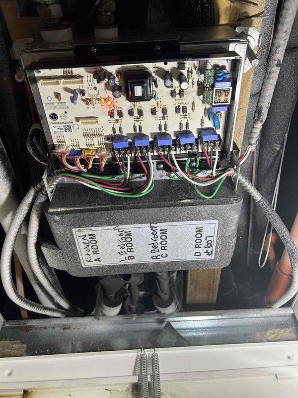 Completed replacement of two condensing motors, inverter board, and PCB board in commercial HVAC system. Installed new electronic control circuit board with multiple relay switches and properly reconnected all wiring to restore system functionality. All components were properly mounted and tested to ensure proper operation of the multi-zone control system.