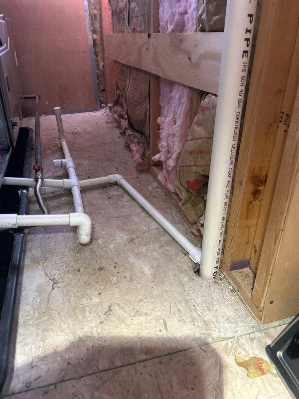 Responded to no-heat call for 1-year-old propane gas system. Inspection revealed damaged electrical conduit at exterior junction box with exposed wiring, compromising system operation. Additionally noted plumbing issues in utility area with exposed PVC piping and incomplete insulation. Repaired damaged conduit and restored power to unit, returning heating functionality to the vacant property.