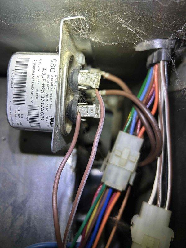 Responded to service call back for no heat issue after initial repair. Found system not heating despite thermostat showing "Heat On" with indoor temperature of 46°F (set point 75°F). Diagnosed and replaced failed capacitor, reconnecting all electrical terminals properly. System now functioning correctly with verified heat output.
