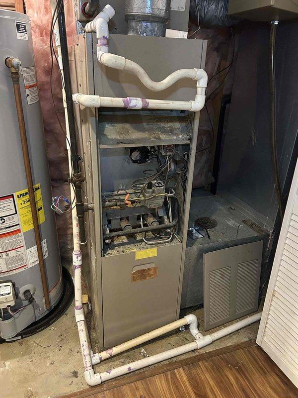 Responded to no-heat call for 40-year-old gas furnace that would only operate in fan-only mode. Diagnostic inspection revealed significant age-related wear on internal components and control mechanisms. Repaired faulty wiring connections in the control circuit and cleaned accumulated dust and debris from critical components to restore proper heating function.