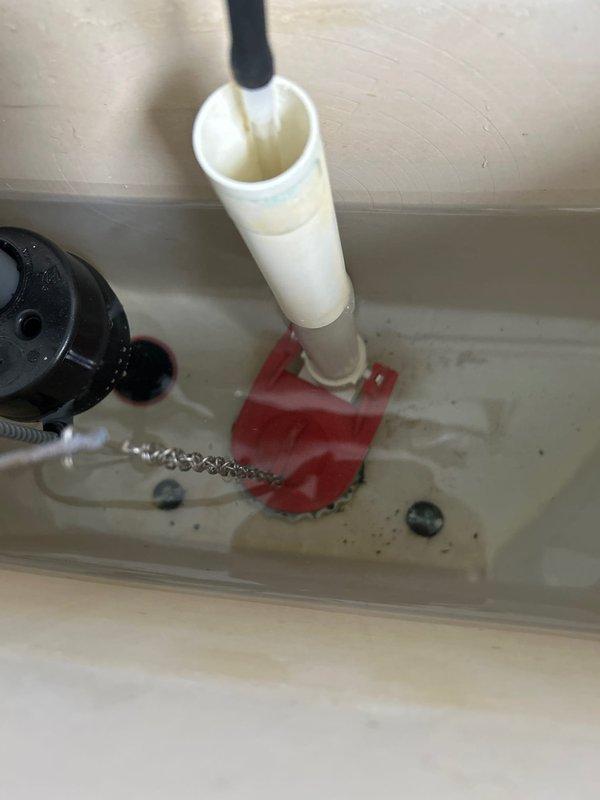 Conducted inspection of reported plumbing issues. Examined washing machine installation where customer reported noise during operation; determined standpipe was inadequately secured and installed proper pipe bracing to eliminate vibration noise. Inspected leaking toilet on main floor; found deteriorated flapper valve causing tank-to-bowl leakage and replaced with new flapper. Also addressed toilet rocking issue by installing new wax ring and properly securing toilet base to floor.