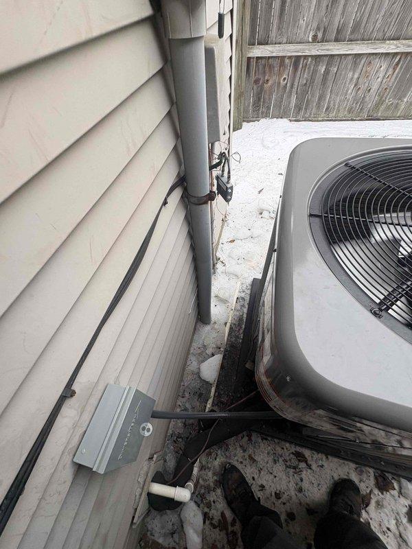 Completed installation of a RUUD 2.5 ton 14.3 SEER2 Two Stage Heat Pump system with matching RUUD Air Handler (attic-mounted) and 15KW Heat Kit. System was properly mounted with standard accessories including outdoor pad, snow legs, electrical connections, refrigerant line components, condensate management features, and connected to existing thermostat and ductwork.