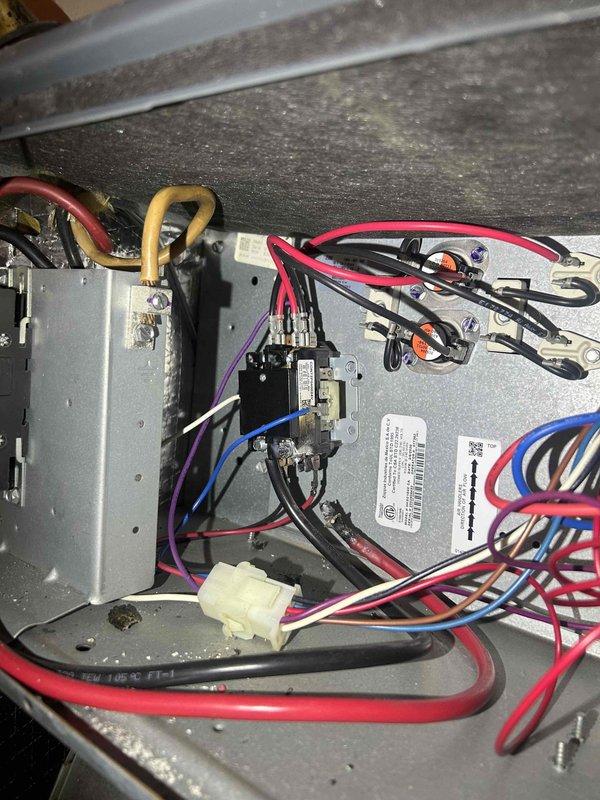 Responded to no heat complaint on 7-8 year old electric InterTech system. Diagnostic testing with multimeter revealed no voltage at control board where customer reported burnt red wire. Inspected electrical connections, identified and replaced damaged control board wiring harness to restore proper connection to thermostat. System functioning normally after repair with heat cycle confirmed.