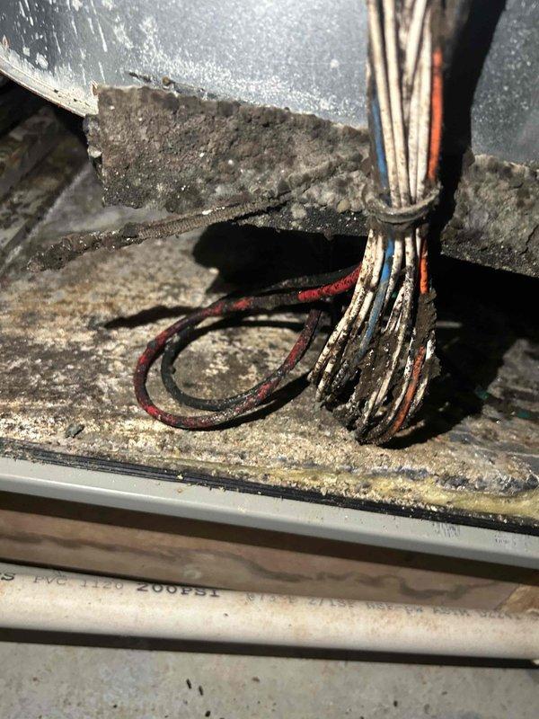Responded to customer report of burnt odor and soot around registers after being away from home. Inspected WaterFurnace geothermal system and found severe dust/dirt accumulation on electrical components, which was likely causing the burning smell. Cleaned electrical connections and housing, replaced air filter (previous one was 2 months old), and verified proper system operation to eliminate odor issue.