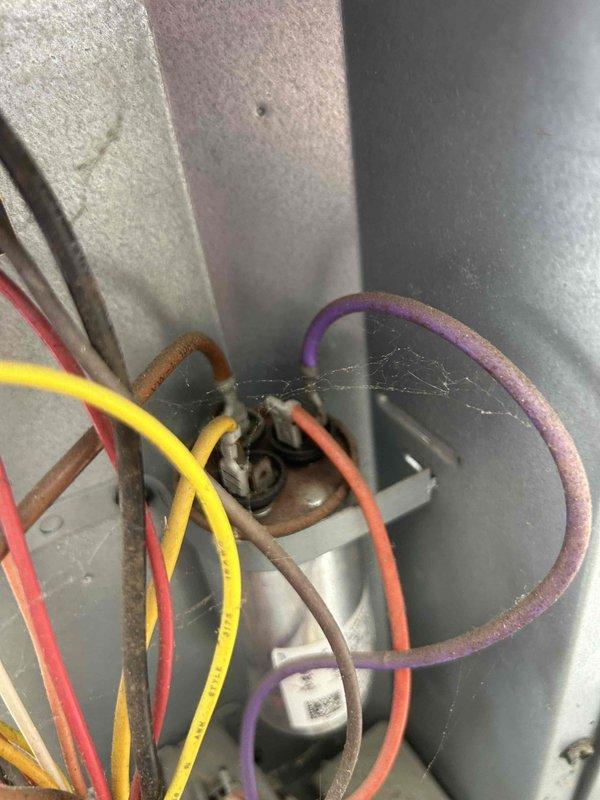 Responded to no heat call for aging heat pump system. Inspection revealed significant dust accumulation and deteriorated wiring connections in the control panel. Cleaned electrical terminals, secured loose connections, and verified proper operation of emergency heat mode. System now functioning correctly with restored heating capability.