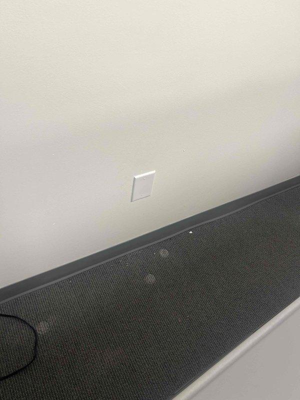 Disconnected desk whips from cubicle workstations as requested by moving company. Verified proper disconnection of all electrical fixtures and confirmed outlets were left in safe condition. Documented work with photos showing the wall fixtures and floor connections prior to completion.