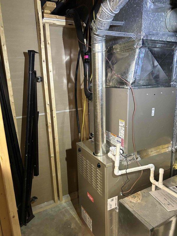 Successfully installed a Bryant 800SB48090M21 80% efficient single-stage gas furnace (90K BTU) with all required connections to existing ductwork, flue piping, and thermostat. Installation included transition to evaporator coil, standard air filter rack, electrical and gas shut-off switches, flexible gas line connector, and flame roll-out protection components.