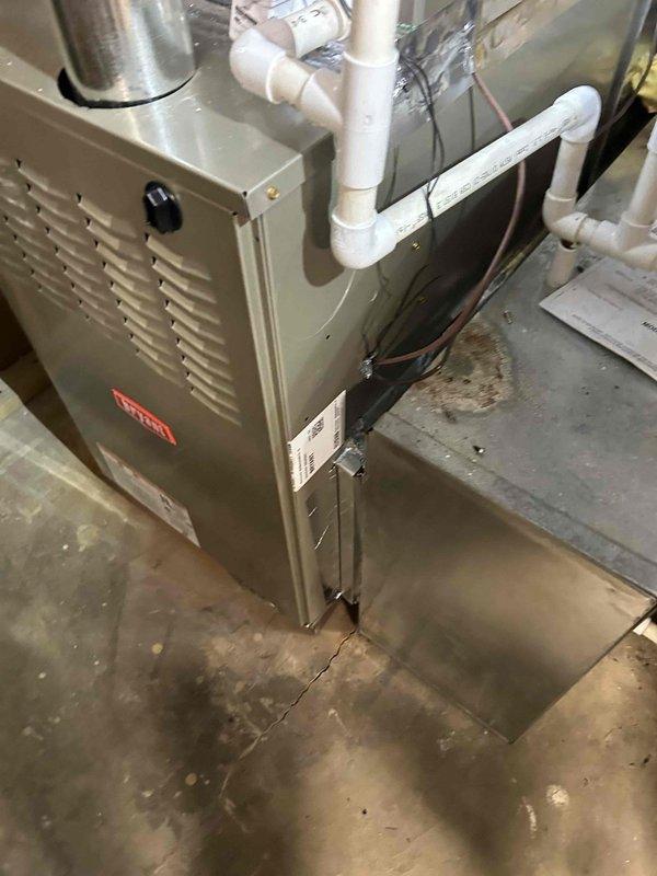 Successfully installed a Bryant 800SB48090M21 80% efficient single-stage gas furnace (90K BTU) with all required connections to existing ductwork, flue piping, and thermostat. Installation included transition to evaporator coil, standard air filter rack, electrical and gas shut-off switches, flexible gas line connector, and flame roll-out protection components.