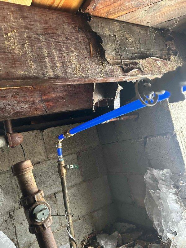 Responded to a callback regarding a water leak in the crawl space. Upon inspection, found damaged wooden joists with significant deterioration and splits near the plumbing infrastructure. Located the source of the leak at a corroded copper pipe joint. Repaired the compromised section by replacing with new PEX piping and brass fittings. Additionally, installed insulation around pipes at the crawl space entrance as requested. Verified system integrity with pressure test after repair. Water was shut off at street valve upon completion per customer instructions.
