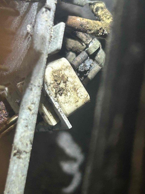 Responded to no heat complaint at Fairfield Inn for three PTAC units in hotel rooms. Upon inspection, discovered significant corrosion and mineral buildup on critical components including heat exchanger and piping. Located Zhongshan Broad-Ocean Motor (model ZWK465A052G01/01900) with electronic protection, which was functioning but compromised by extensive aging and oxidation of surrounding components. Cleaned accessible parts and restored heating function to all three units, but recommended scheduling replacement of aging components due to visible deterioration that may lead to future failure.