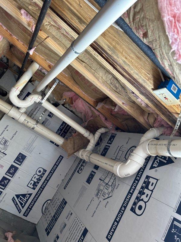 Conducted a comprehensive 60-point plumbing inspection to investigate customer's water pressure issues reportedly following recent toilet and water heater installation. Inspection revealed significant structural wood deterioration and water damage in the basement/crawlspace area, likely contributing to the reported problems. Documented condition of PVC plumbing system and identified potential correlation between the damaged wooden supports and the water pressure concerns.