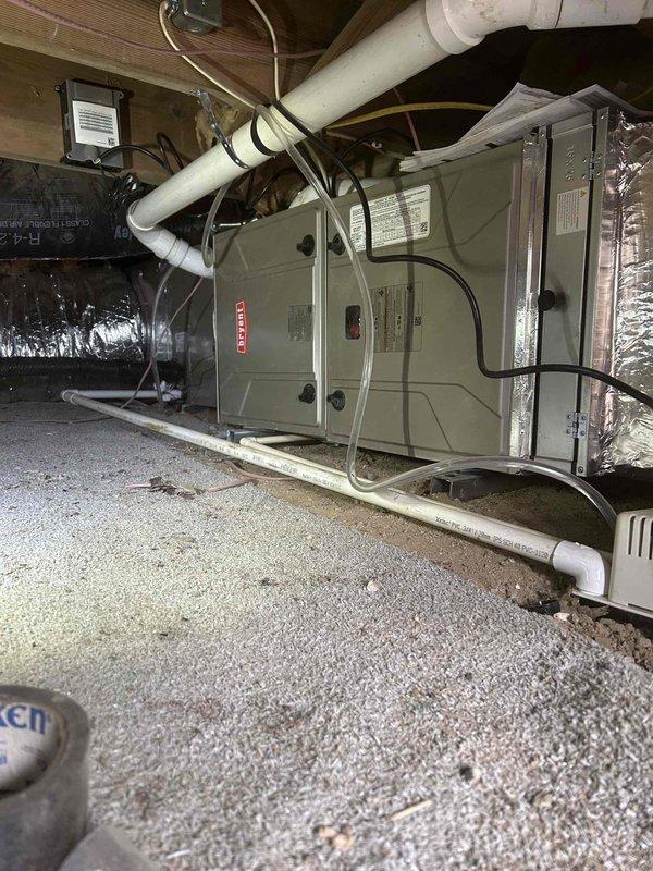 Completed return visit to finalize HVAC installation. Installed outdoor condensing unit, completed remaining indoor furnace connections, and verified proper system operation. Performed comprehensive system check with pressure testing (readings verified at 5.83/5.82) and documented installation with photos of the Bryant furnace unit and associated ductwork/ventilation components.