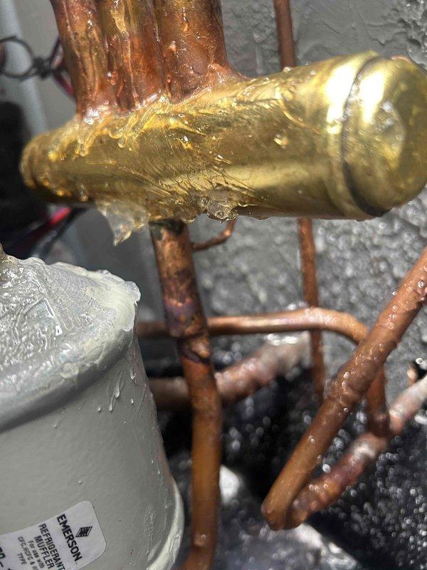 Successfully completed warranty replacement of the indoor TXV. Observed frost/condensation buildup on components prior to repair, indicating refrigerant flow restriction. System now operating with proper refrigerant flow and no moisture issues after installation.