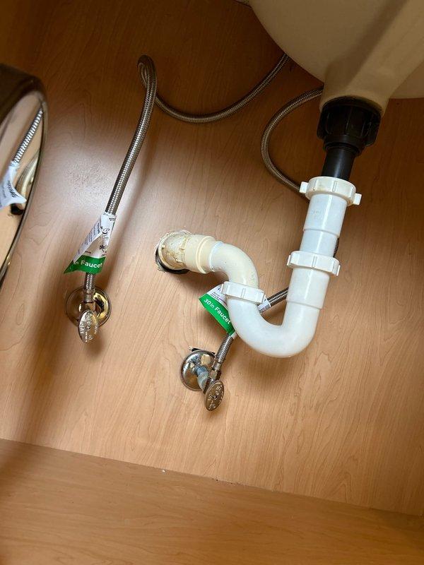 Successfully removed and disposed of two existing lavatory faucets and installed new Delta replacement units. Replaced pop-up drains and connected to existing shut-off valves. Verified proper function with no leaks present upon completion of installation.