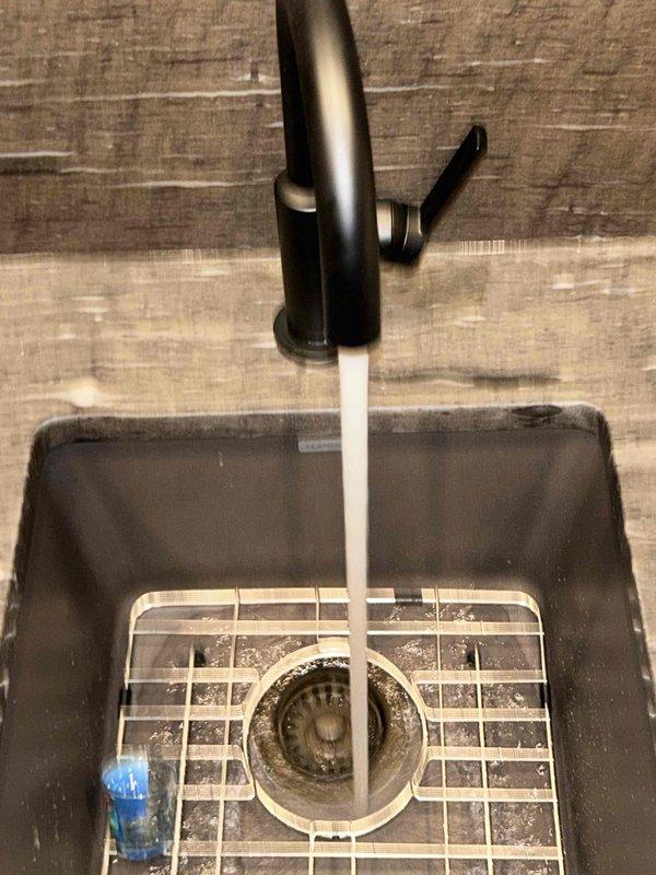 Completed routine plumbing inspection as requested. Examined copper bathroom sink and fixtures, confirming proper installation and function. Tested kitchen sink water flow, observing normal drainage with no evident leaks or blockages in either location.