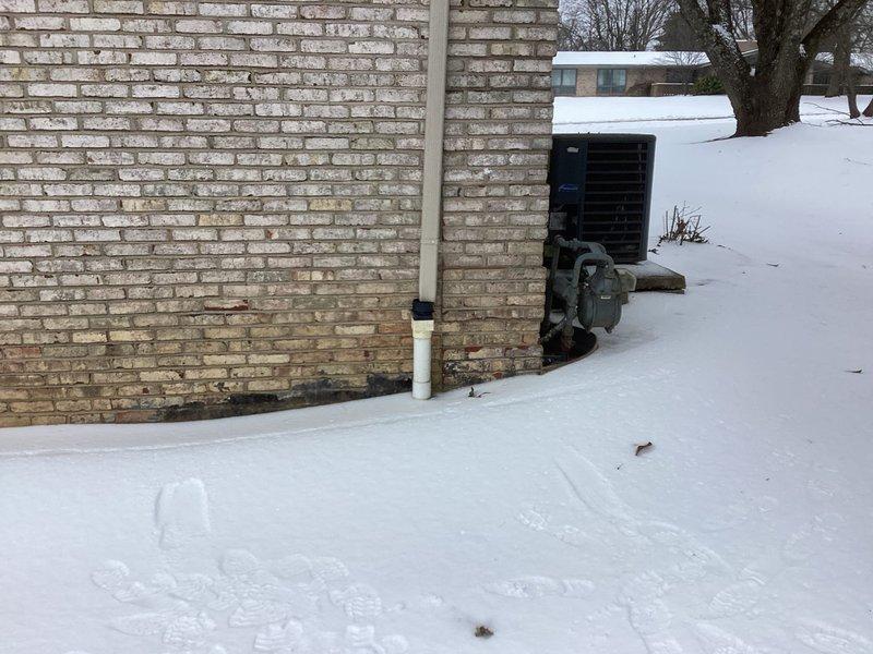 Conducted site assessment for generator installation at residential property. Evaluated exterior mounting location adjacent to existing HVAC equipment on brick wall. Documented current electrical setup including junction boxes and conduit paths for proper integration of new generator system.