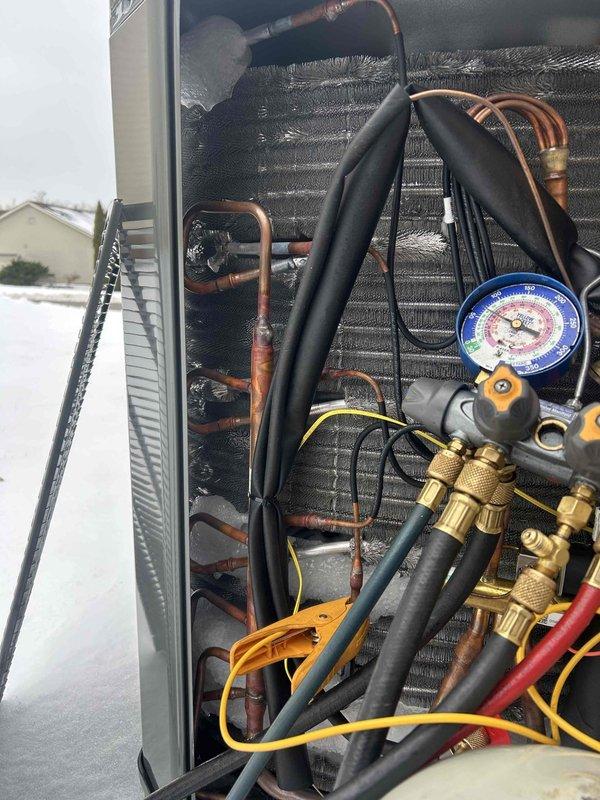 Responded to callback for heat pump underperforming (67°F set point, 61-62°F actual). Performed diagnostic testing with manifold gauge set on outdoor unit. Inspected supplementary electric heater components and verified proper operation. System now maintaining desired temperature.