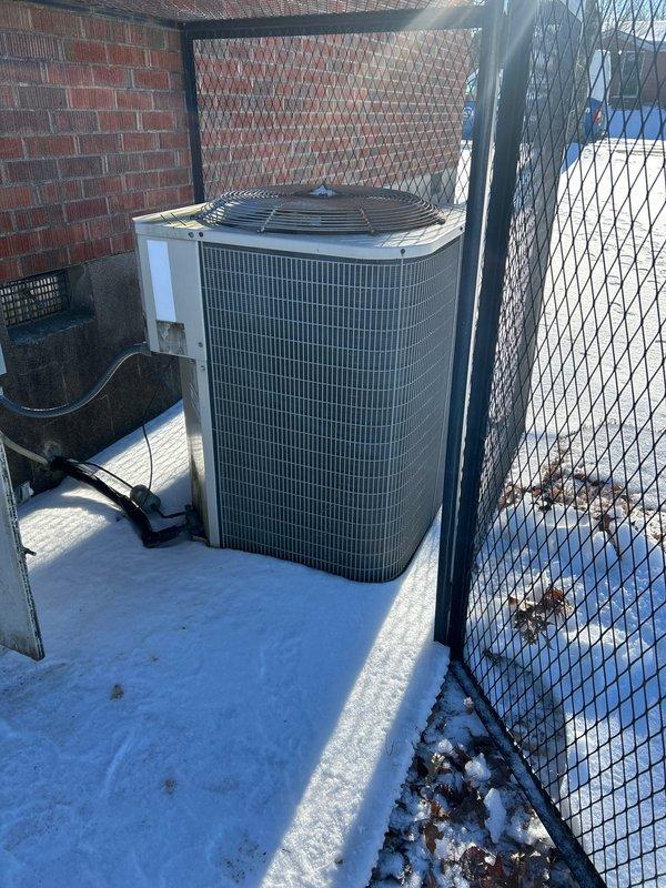 Responded to no heat complaint on property being prepared for sale. Inspection revealed a rusted heat exchanger with significant corrosion around ports, compromising system safety. Outdoor condenser unit was operational but surrounded by snow accumulation. Replaced faulty heat exchanger and cleared snow from around outdoor unit to restore proper system function and ensure safe operation.