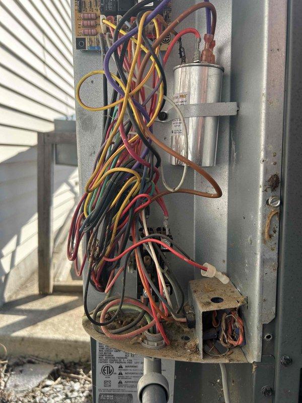 Performed Care Plan Tune Up on dual heat pump and air handler system located in attic and garage. Inspected electrical components and capacitor connections, noting some wire disorganization. Replaced four 14x14x1 filters and verified proper installation of 14x20x1 filters as included in maintenance plan.