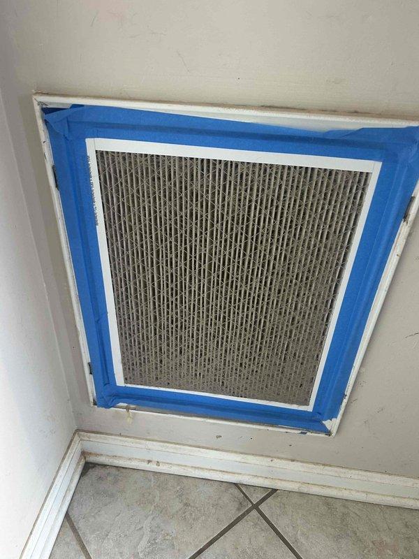Performed Care Plan Tune Up on heat pump/gas furnace system located in closet. Inspected existing air filter which showed normal dust accumulation and was temporarily secured with painter's tape. Examined evaporator coil which appeared clean with no visible damage, ensuring proper heat transfer capability.