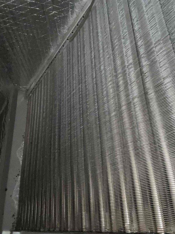 Performed Care Plan Tune Up on heat pump/gas furnace system located in closet. Inspected existing air filter which showed normal dust accumulation and was temporarily secured with painter's tape. Examined evaporator coil which appeared clean with no visible damage, ensuring proper heat transfer capability.