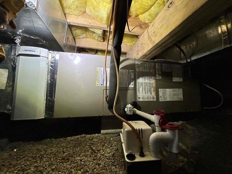 Successfully installed a complete Bryant HVAC system featuring a 2-ton 14.3 SEER2 single stage heat pump (model GH5SAN52400A) paired with a 2-ton air handler (model FJ5ANXB24L00) and 10KW heat kit (KFFEH2601C10). Installation included an Aprilaire 1000 Media Cabinet for improved air filtration, condensate pump system with PVC piping, and connection to the existing thermostat. All equipment was properly mounted with the outdoor unit positioned on a concrete pad with appropriate electrical connections and the indoor unit installed in the basement with proper refrigerant lines and ductwork.