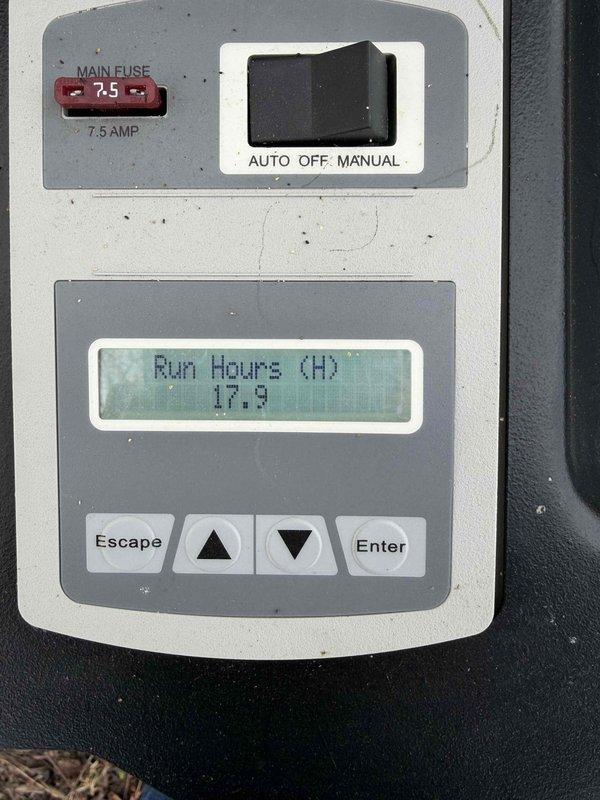 Performed routine maintenance on residential Generac air-cooled generator. Inspected unit for external condition, noting some weathering on the housing. Checked control panel functionality, verified main 7.5 AMP fuse integrity, and confirmed proper AUTO/OFF/MANUAL switch operation. System displaying 17.9 run hours with no operational issues detected.