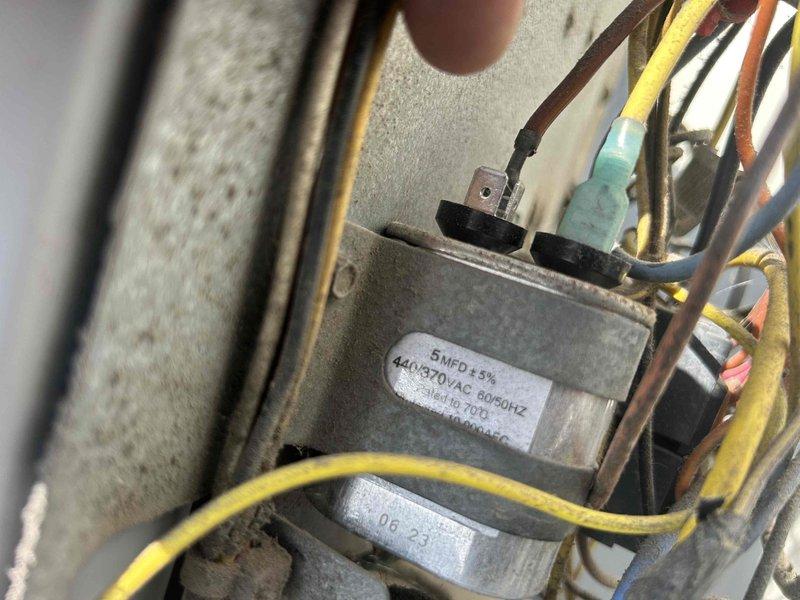 Responded to commercial no-heat complaint for electric HVAC system experiencing loud noises and inadequate heating for past two days. Inspection revealed failed 5MFD 440/370VAC capacitor in outdoor unit, which was replaced to restore normal system operation and heat production.