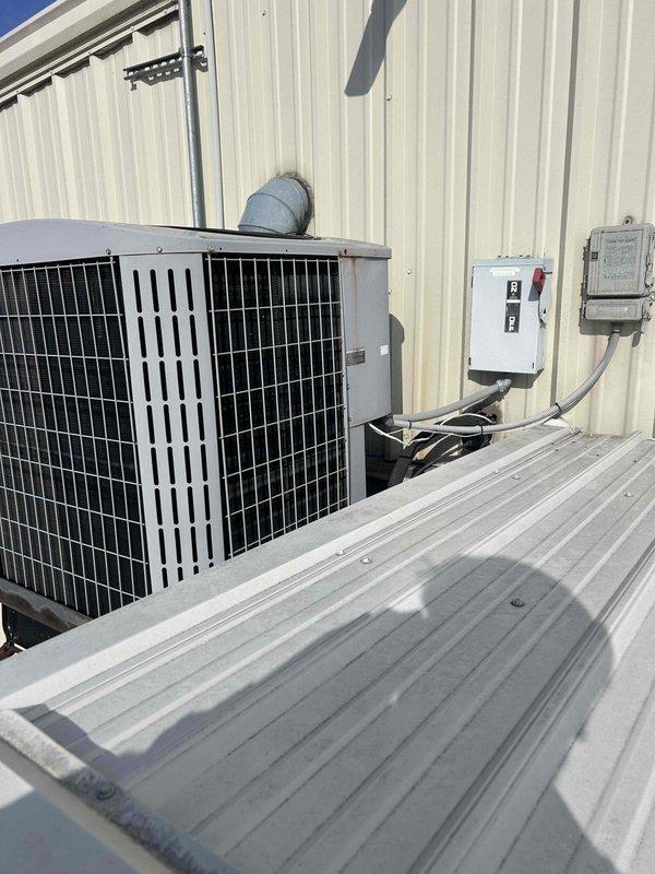 Responded to commercial no-heat complaint for electric HVAC system experiencing loud noises and inadequate heating for past two days. Inspection revealed failed 5MFD 440/370VAC capacitor in outdoor unit, which was replaced to restore normal system operation and heat production.