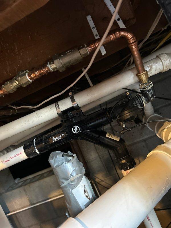 Responded to service call for continuously running sump pump. Diagnosed frozen discharge line as the cause and temporarily rerouted discharge to main sewer line. Identified leak on backup water pump line. Will return to reconnect sump pump to existing discharge line and repair the backup pump line leak.