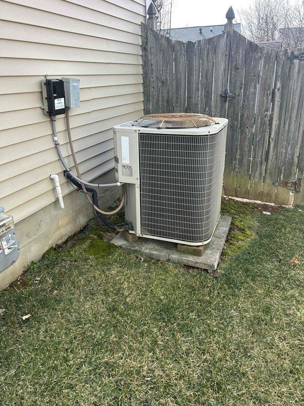 Completed Club Green PSA tune-up on customer's AC and gas furnace as requested by Andrew. Performed visual inspection of outdoor condenser unit, which showed normal weathering but remains properly installed on concrete pad with intact electrical connections. Conducted electrical testing on furnace components with multimeter, recording amperage reading of 0.27 during diagnostic evaluation of blower motor assembly.