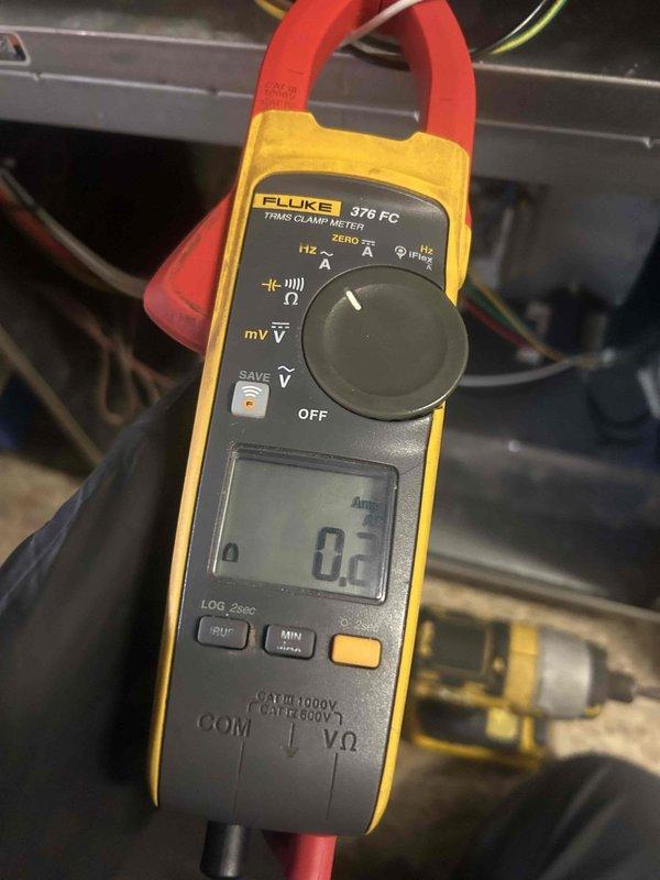 Performed Care Plan Tune Up on AC/GF system with humidifier located in first floor closet of split foyer residence. Inspected and documented dirty air filter/evaporator component with significant debris accumulation. Conducted electrical diagnostic testing using Fluke 376 FC True RMS Clamp Meter to verify proper system operation.