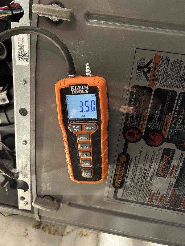 Successfully completed installation of a RUUD dual fuel system featuring a 14.3 SEER2 3-ton heat pump, 96% two-stage gas furnace, and 3-ton evaporator coil with proper ductwork modifications. System was pressure-tested with manometer confirming 35.0 reading, and gas line installation was completed with appropriate sleeving through wall penetrations as required.