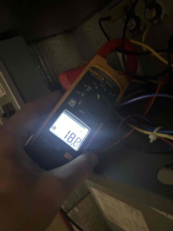 Performed Care Plan Tune Up on heat pump/air handler located in basement. Conducted electrical testing using Fluke 376 FC clamp meter, confirming proper amperage readings with measurements at 0.0A and 18.2A across system components. Replaced customer-supplied 20x20x1 air filter as part of routine maintenance.