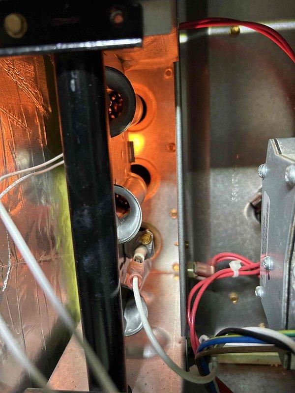 Performed routine care plan tune-up on ground floor AC equipment located in crawlspace. Inspected gas furnace, confirming proper ignition sequence with normal blue flame pattern at burners and correct operation of heating elements. Visual inspection showed components in good working condition with no signs of wear or damage.