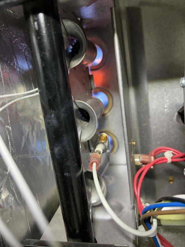 Performed routine care plan tune-up on ground floor AC equipment located in crawlspace. Inspected gas furnace, confirming proper ignition sequence with normal blue flame pattern at burners and correct operation of heating elements. Visual inspection showed components in good working condition with no signs of wear or damage.