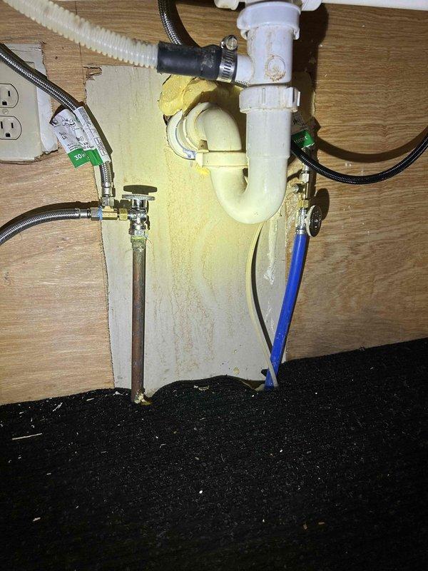 Completed kitchen faucet replacement with customer-supplied fixture, along with replacement of both hot and cold water shut-off valves under sink. Removed section of galvanized water piping on cold side, installed new shut-off valve for faucet and refrigerator line, and replaced hot-side shut-off with new tee fitting for dishwasher supply line. All connections were tested to confirm proper function with no leaks.