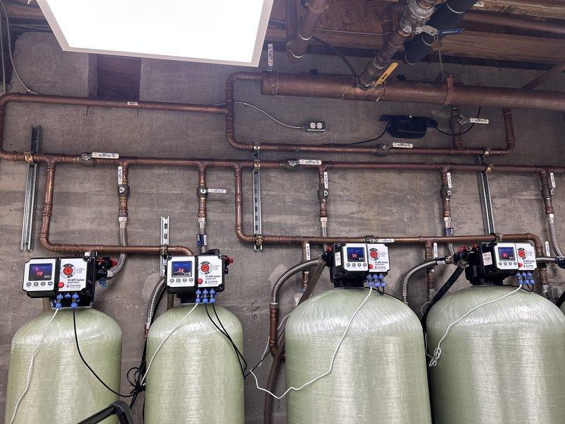Responded to a "No Water" service call affecting the entire residence. Upon inspection, discovered a malfunction in the customer's water treatment system consisting of four interconnected filtration tanks with digital control panels. Performed diagnostic testing on the system controls and restored proper water flow by adjusting valve settings and recalibrating the electronic control parameters.