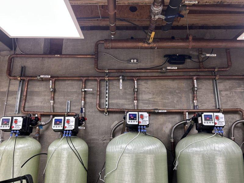 Responded to a "No Water" service call affecting the entire residence. Upon inspection, discovered a malfunction in the customer's water treatment system consisting of four interconnected filtration tanks with digital control panels. Performed diagnostic testing on the system controls and restored proper water flow by adjusting valve settings and recalibrating the electronic control parameters.