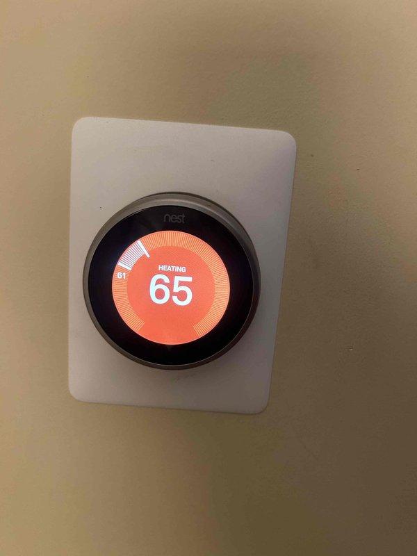 Performed Care Plan Tune Up on Trane AC/GF system located in utility closet hallway. Conducted electrical testing with Fieldpiece meter on system components, confirming proper voltage readings. Verified Nest thermostat operation in heating mode with temperature set at 65°F. Customer-supplied 16x16x1 filter was installed during service.