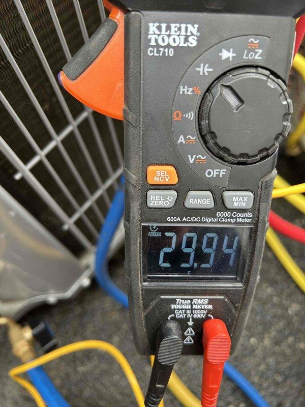 Performed annual care plan tune-up on HP/AH unit located in closet. Conducted electrical testing with Klein Tools CL710 multimeter, measuring voltage readings of 49.84V and 29.94V at various points to verify proper electrical operation. Inspected existing 20x20x1 air filter and discussed replacement options with customer.