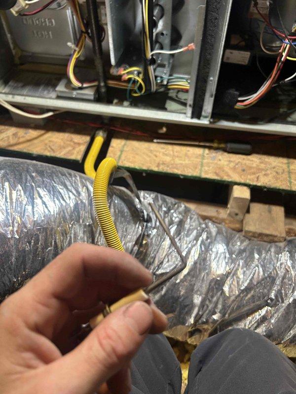 Performed scheduled Care Plan tune-up on AC and gas furnace after 3:00 PM as requested by customer. Inspected burner assembly for proper combustion, observing clean blue flames indicating efficient operation. Checked gas line connections and verified proper installation of insulated ductwork and electrical components.