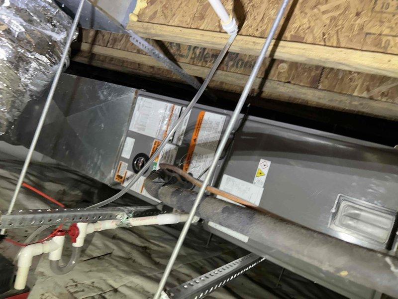 Completed installation of a RUUD 2.5-ton 14.3 SEER2 Two Stage Heat Pump system with matching air handler and 10KW heat kit in residential property. Work included replacing existing 14" flex return with new 16" foil flex, installing condensate safety sensor, repairing dryer vent in crawl space, and connecting to existing ductwork with proper transitions. System is fully operational with all manufacturer-specified components installed according to code requirements.